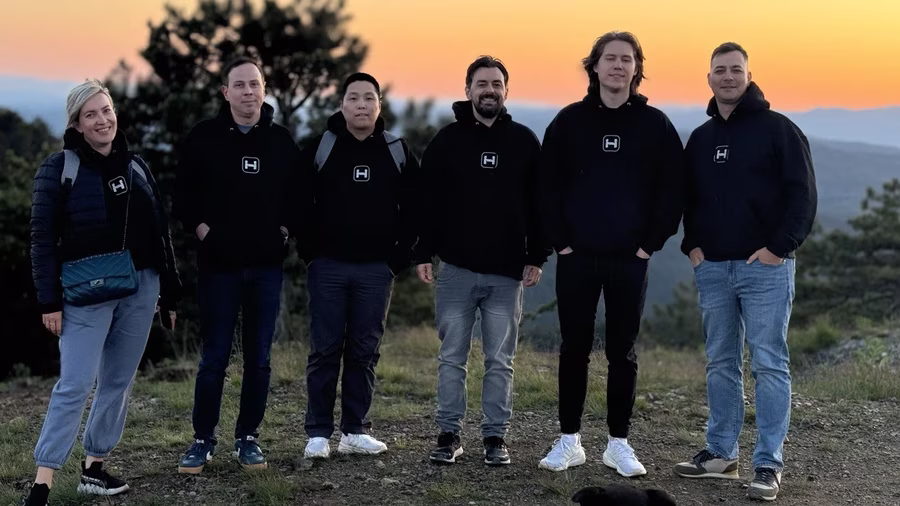 The Whales team outdoors at sunset